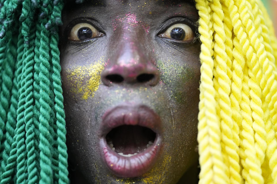 A Cameroon supporter cheers prior to the World Cup group G soccer match between Switzerland and Cameroon, at the Al Janoub Stadium in Al Wakrah, Qatar, Thursday, Nov. 24, 2022. (AP Photo/Ebrahim Noroozi)
