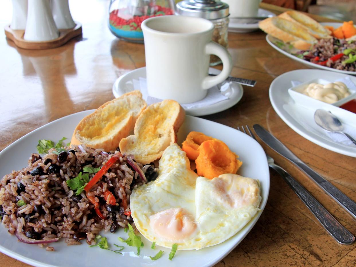 Traditional Gallo Pinto breakfast with eggs, Costa Rica, Central America