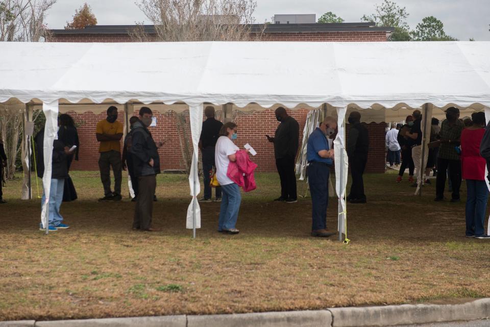 Voters wait in line outside of the Chatham County Board of Elections Office at 1117 Eisenhower Drive on Monday during the first day of early voting. By 12:30 p.m., 1,300 people had cast an early ballot across Chatham County. [Will Peebles/Savannahnow.com]