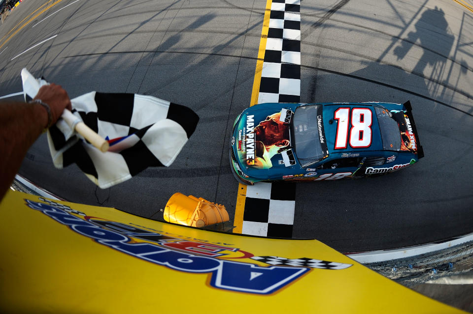 TALLADEGA, AL - MAY 05: Joey Logano, driver of the #18 GameStop Toyota, celebrates with the checkered flag after winning the NASCAR Nationwide Series Aaron's 312 at Talladega Superspeedway on May 5, 2012 in Talladega, Alabama. (Photo by Jared C. Tilton/Getty Images)