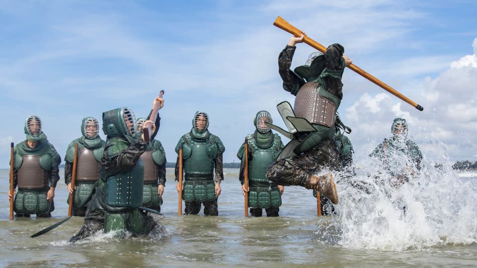 Armed police officers and soldiers training in seawater in Fangchenggang City, China's Guangxi autonomous region, on July 24, 2023 - Costfoto/NurPhoto/Getty Images