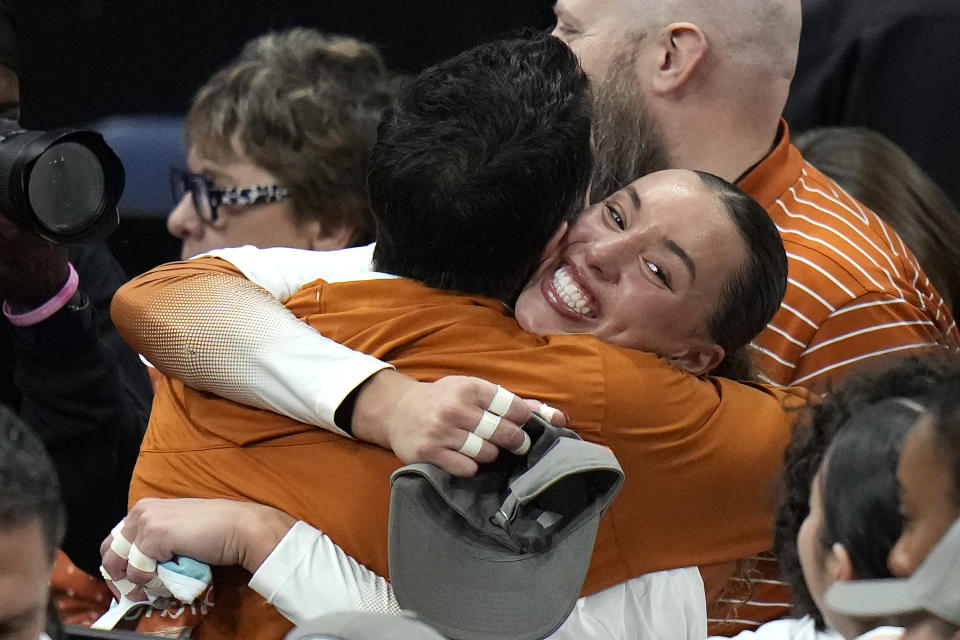 Texas's Madisen Skinner, right, celebrates after the team won the NCAA Division I women's college volleyball tournament against Nebraska Sunday, Dec. 17, 2023, in Tampa, Fla. (AP Photo/Chris O'Meara)