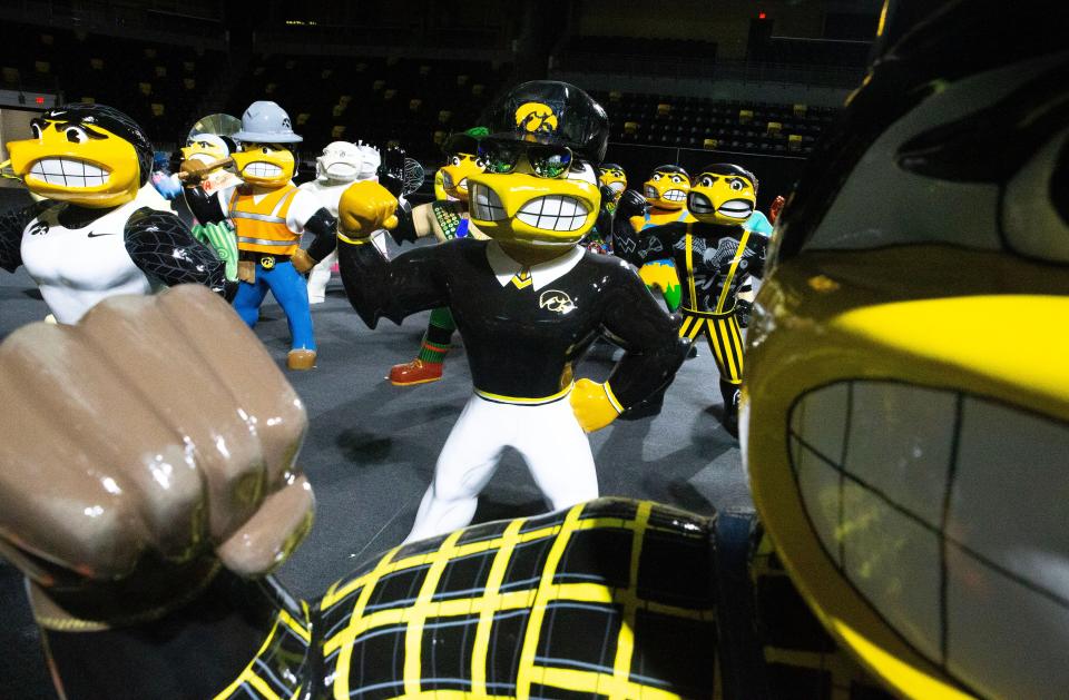 Completed versions of the third iteration of the Herky on Parade statudes stand Monday, April 29, 2024 at Xtream Arena in Coralville, Iowa.