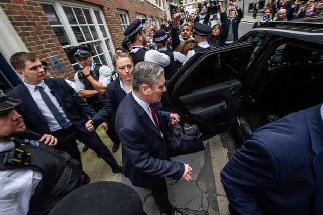Keir Starmer is surrounded by police as he leaves Chatham House after delivering a speech on the situation in the Middle East.