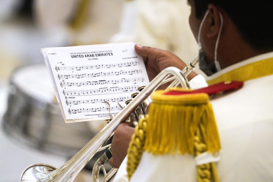 A member of an Emirati military band prepares ahead of a visit by Turkish President Recep Tayyip Erdogan, at Qasr Al-Watan, in Abu Dhabi, United Arab Emirates, Monday, Feb. 14, 2022. Erdogan traveled Monday to the United Arab Emirates, a trip signaling a further thaw in relations strained over the two nations' approaches to Islamists in the wake of the 2011 Arab Spring. (AP Photo/Jon Gambrell)