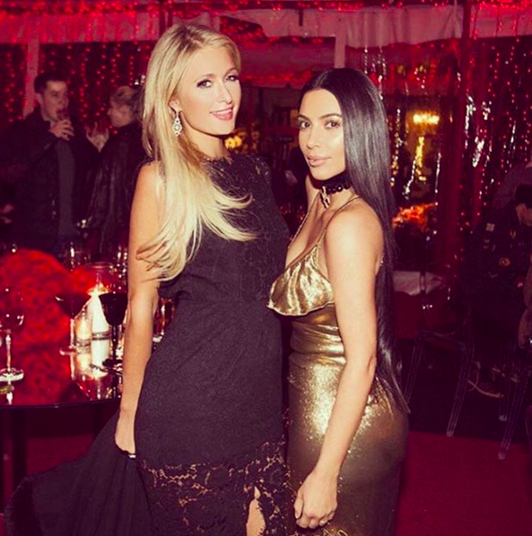 Paris Hilton and Kim Kardashian get in the Christmas spirit together. (Photo: Instagram)