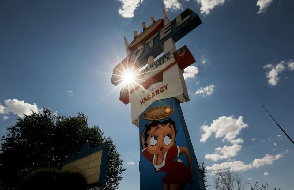 A motel sign stands along Route 66 in Seligman, Ariz.