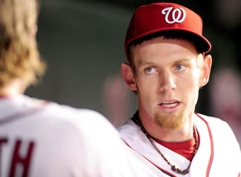 Stephen Strasburg gets congratulated by teammate Jason Werth after throwing five shutout innings on Tuesday in his first major league start since rehabbing from Tommy John surgery