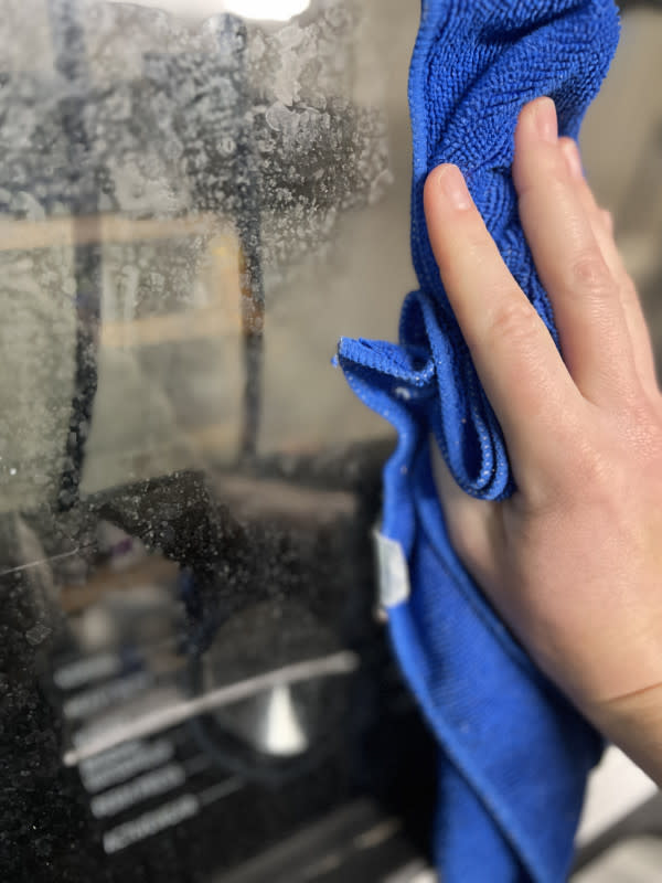 Remove hard water spots from the window of your washing machine.<p>Emily Fazio</p>