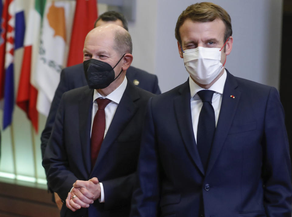 French President Emmanuel Macron (R) and German Chancellor Olaf Scholz leave the EU summit in Brussels, Belgium, 17 December 2021. EPA-EFE/STEPHANIE LECOCQ/ POOL