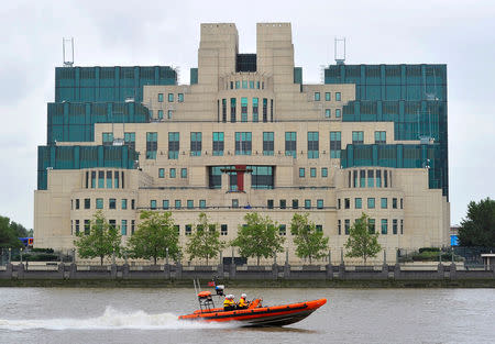 A motorboat passes by the MI6 building in London August 25, 2010. REUTERS/Toby Melville/Files