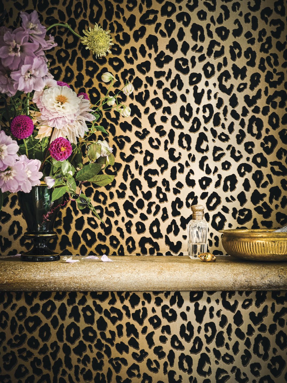 This image released by Romo and Temperley London shows a leopard print wallpaper pattern. Wallpaper is back in a big way, decor experts say, and many make a statement through story or texture. (Romo and Temperley London via AP)