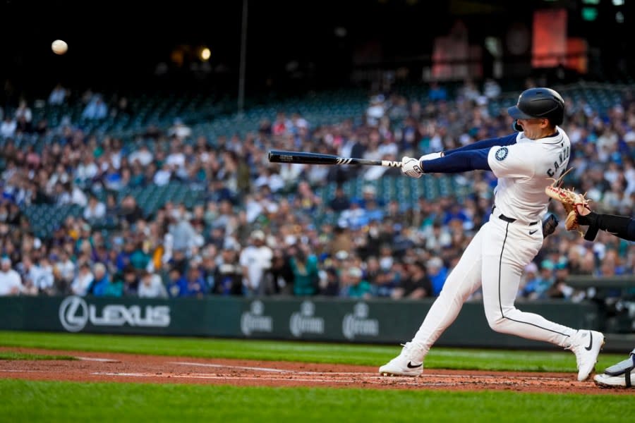 Seattle Mariners’ Dominic Canzone hits a three-run home run against the Cleveland Guardians during the second inning of a baseball game Monday, April 1, 2024, in Seattle. (AP Photo/Lindsey Wasson)