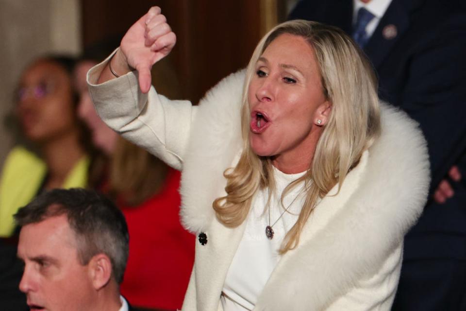 Marjorie Taylor Greene heckles Joe Biden during his State of the Union address (Getty)