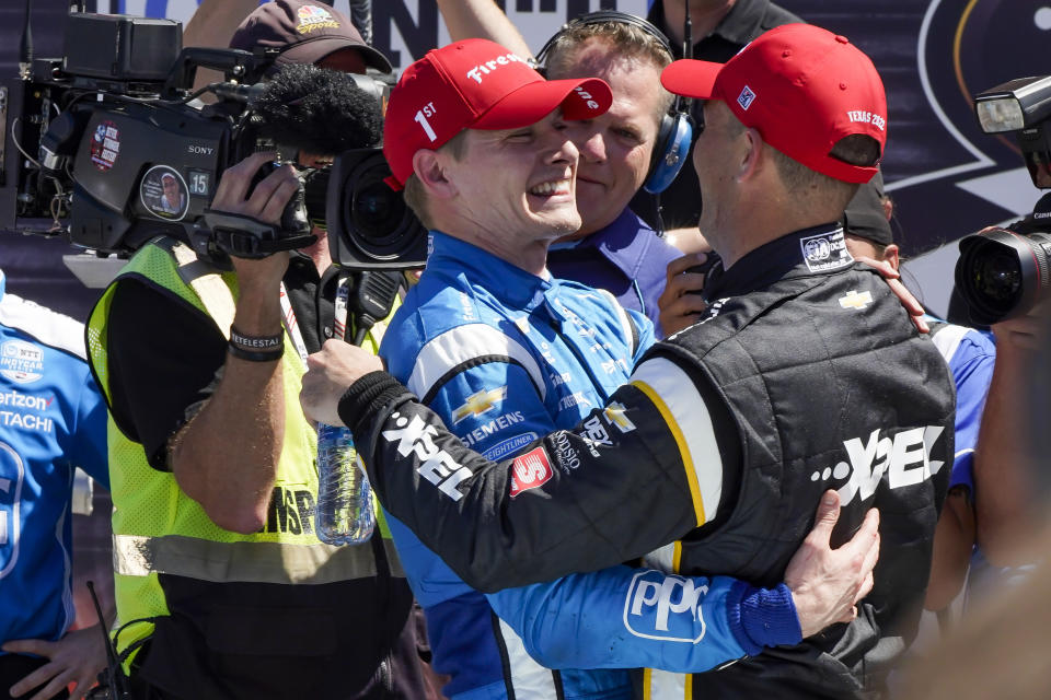 From left, Josef Newgarden and Scott McLaughlin embrace following the NTT IndyCar Series XPEL 375 at Texas Motor Speedway in Fort Worth, Texas, Sunday, March 20, 2022. Newgarden won the race and McLaughlin finished second. (AP Photo/Larry Papke)