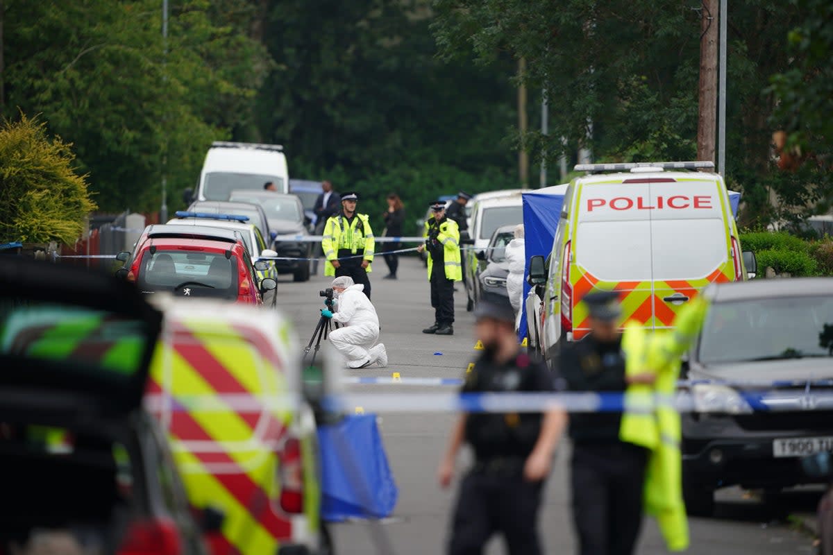 Forensic officers near a property in Barnard Road in Gorton, Manchester (Peter Byrne/PA) (PA Wire)