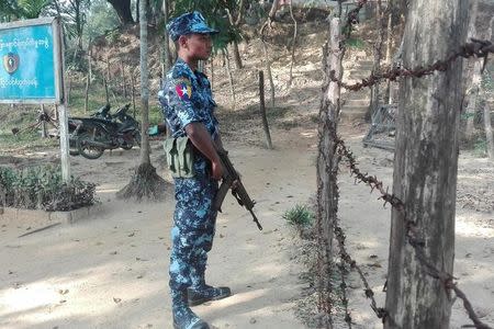 A Myanmar policeman stands outside of a camp set up by Myanmar's Social Welfare, Relief and Resettlement Minister to prepare for the repatriation of displaced Rohingyas, who fled to Bangladesh, outside Maungdaw in the state of Rakhine, Myanmar January 24, 2018. REUTERS/Stringer NO RESALES NO ARCHIVES