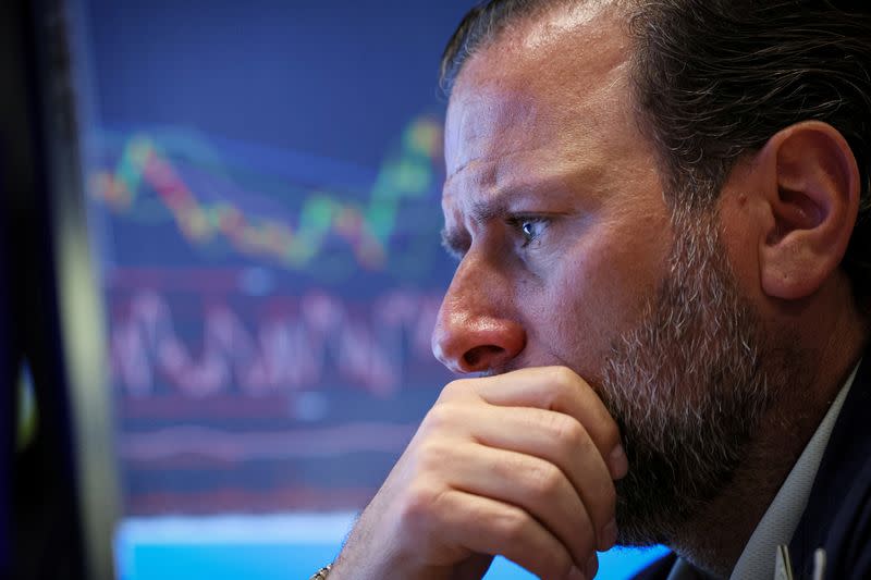 Traders work on the floor of the NYSE in New York