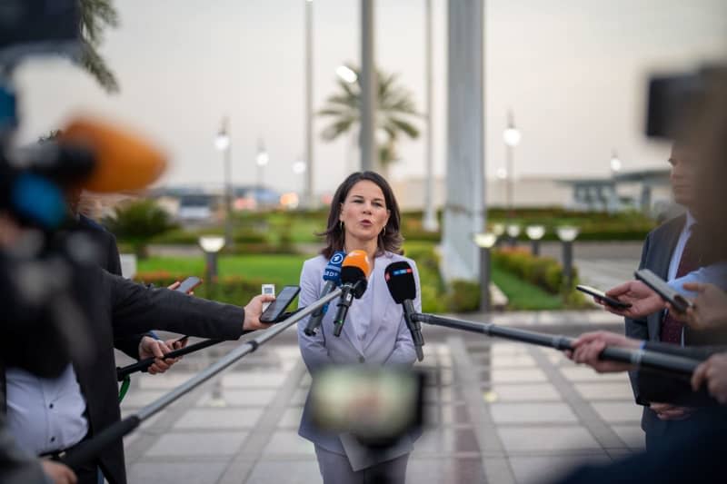 German Foreign Minister Annalena Baerbock gives a press statement upon her arrival at the airfield in Jeddah. Michael Kappeler/dpa