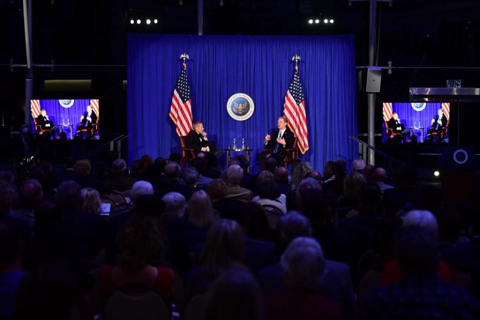 FBI director Christopher Wray (R) speaks at the Reagan Library in Simi Valley, California, 31 January, 2022. (AFP via Getty Images)