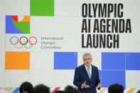 Thomas Bach, IOC President speaks at the International Olympic Committee launch of the Olympic AI Agenda at Lee Valley VeloPark, in London, Friday, April 19, 2024. The IOC will be presenting the envisioned impact that artificial intelligence can deliver for sport, and how the IOC intends to lead on the global implementation of AI within sport. (AP Photo/Kirsty Wigglesworth)