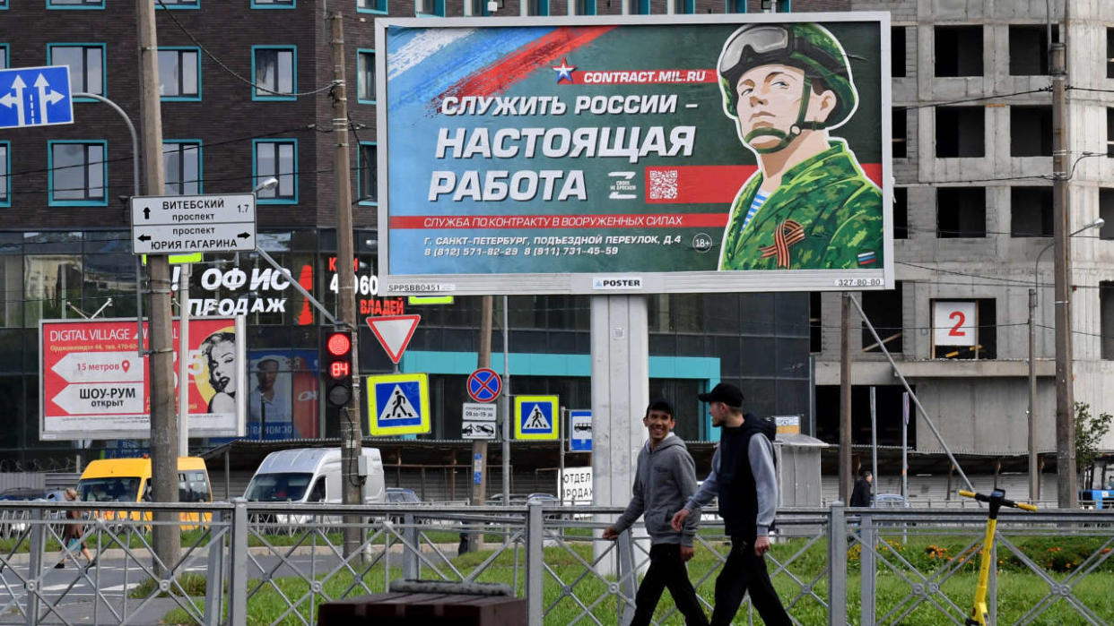 A billboard promoting contract army service with an image of a serviceman and the slogan reading 