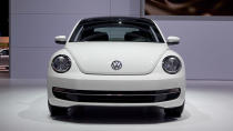 Volkswagen just unveiled the 2013 Volkswagen Beetle TDI, an oil-burning version of the recently revised and manliness-infused Beetle. America's only diesel two-door (VW considers this a coupe and the Golf a hatch) will go on sale this summer. The engine is VW's familiar 2.0 liter turbocharged and direct-injected 4-cylinder, now sporting a common-rail fuel injection setup and putting 140 horsepower and 238 lb/ft of torque into your choice of six-speed transmissions: either a traditional manual or the DSG semiautomatic. EPA fuel economy scores of 29 mpg city and 39 mpg highway have been confirmed.