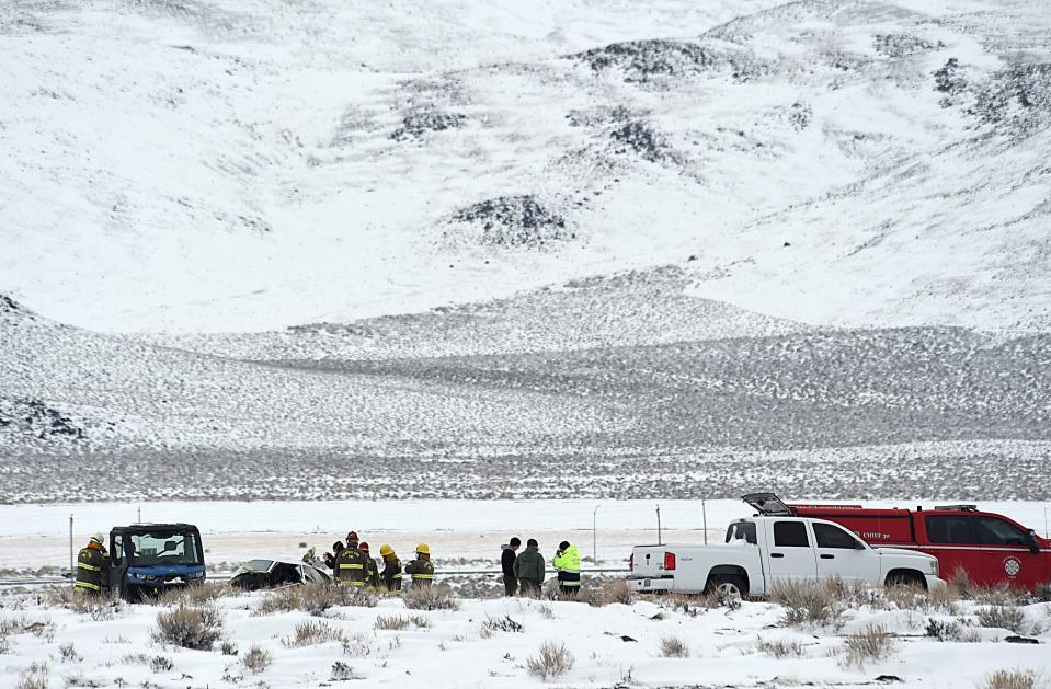 Authorities investigate the site of a Care Flight plane that crashed near Stagecoach on Feb. 25, 2023. Five people were killed in the crash.