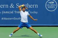 Aug 19, 2017; Mason, OH, USA; Grigor Dimitrov (ESP) returns a shot against John Isner (USA) during the Western and Southern Open at the Lindner Family Tennis Center. Mandatory Credit: Aaron Doster-USA TODAY Sports