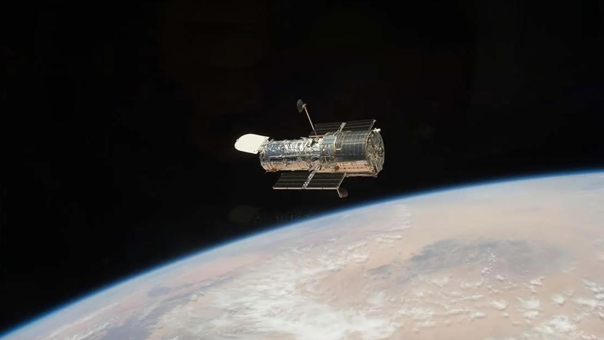  The Hubble Space Telescope in orbit around Earth. 