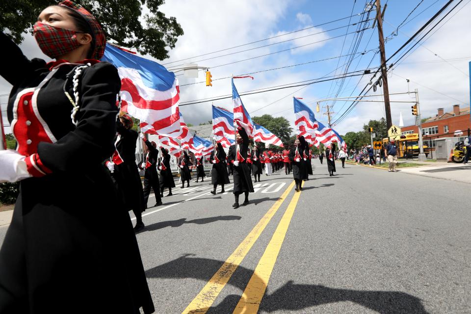 The Bergenfield High School Color Guard and Marching Band takes part in the Memorial Day Parade. Monday May 31, 2021