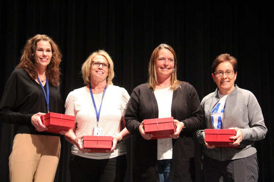 Perry Schools staff members receive 25 years of service awards during a presentation on Wednesday, May 22, 2024.