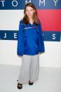 <p>The Tommy Girl paired 2000's hottest outerwear, the anorak, with wide-legged pants at another Tommy Jeans event a couple years later.</p>