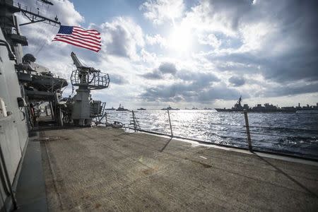 U.S. Navy and Japan Maritime Self-Defense Force ships steam in formation during their military manoeuvre exercise known as Keen Sword 15 in the sea south of Japan, in this November 19, 2014 handout provided by the U.S. Navy. REUTERS/Mass Communication Specialist 3rd Class Bradley J. Gee/U.S. Navy/Handout via Reuters