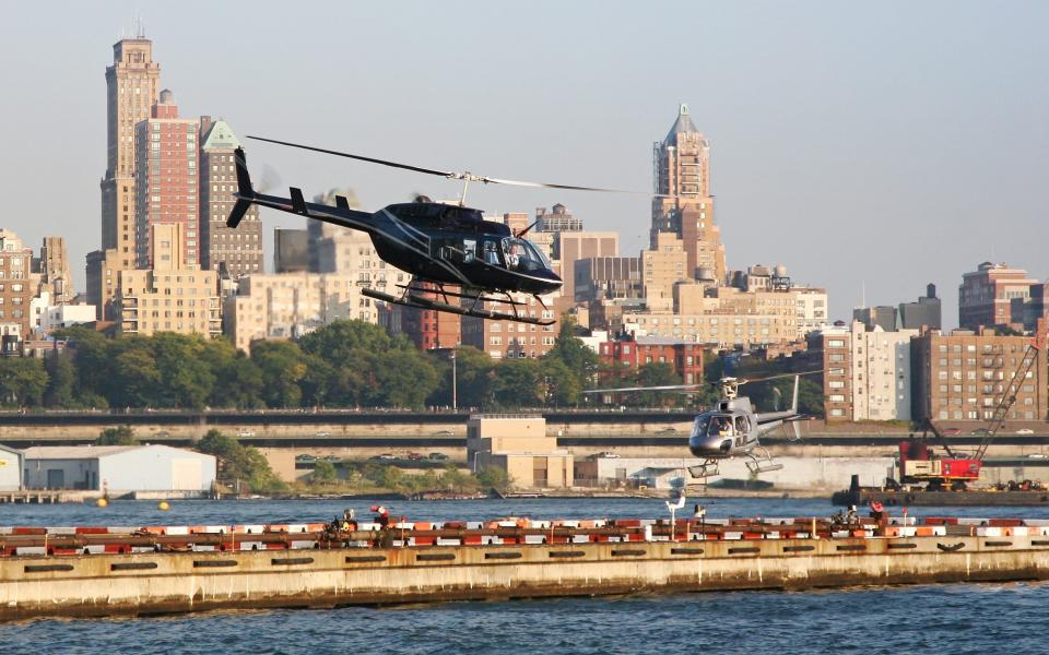 Helicopters taking off from the heliport in downtown New York City
