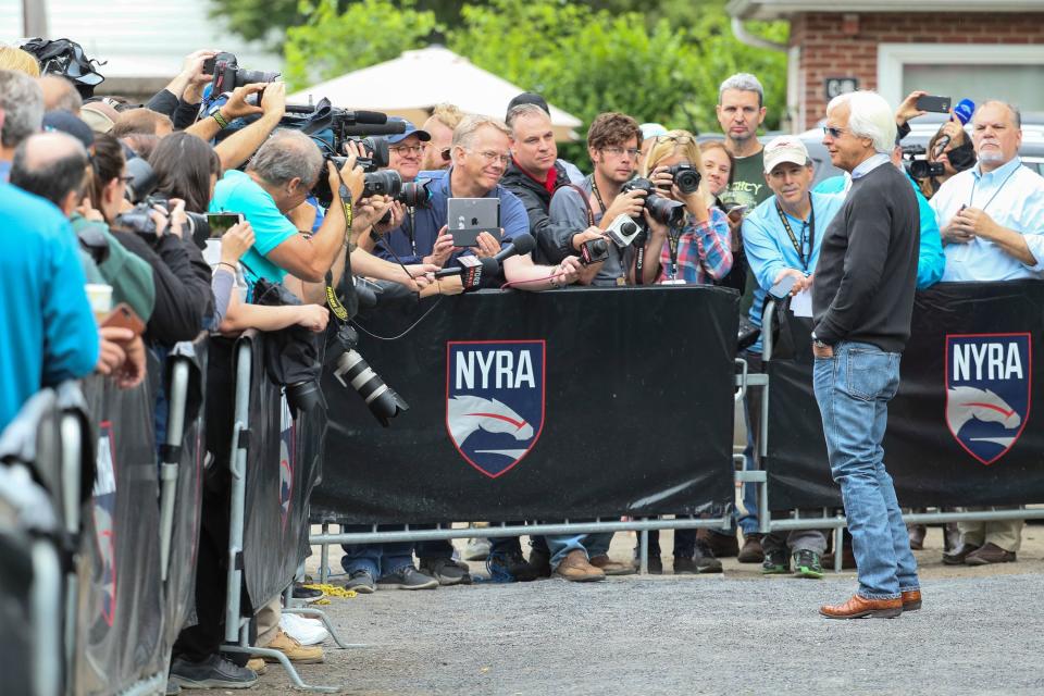 Bob Baffert talks to the media outside of the barn where Justify is housed at Belmont Park.
 Michael Clevenger/ Courier Journal
Bob Baffert talks to the media outside of the barn where Justify is housed at Belmont Park. June 10, 2018