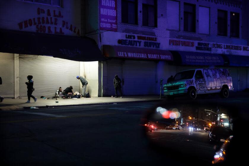 LOS ANGELES, CALIFORNIA - APRIL 18: Homeless people hang out in Downtown Los Angeles. (Wally Skalij/Los Angeles Times)