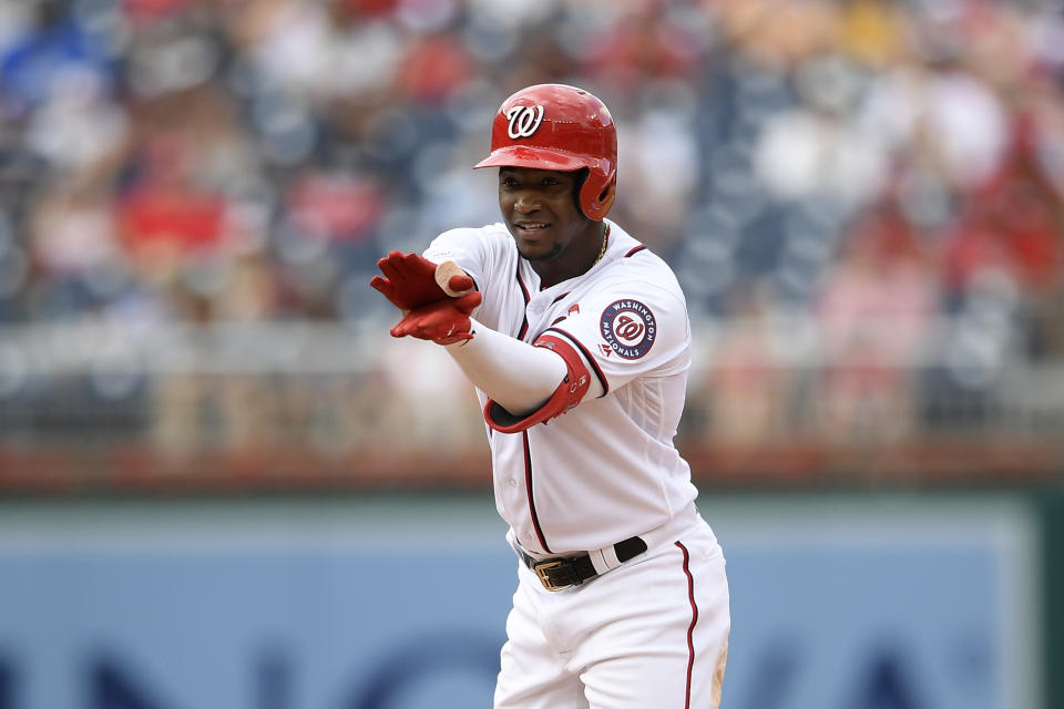 Washington Nationals' Victor Robles gestures as he stands on second base with a double during the third inning of a baseball game against the Milwaukee Brewers, Sunday, Aug. 18, 2019, in Washington. (AP Photo/Nick Wass)