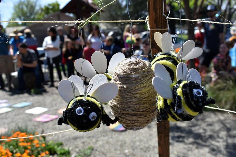 A bee mobile hangs in the children’s garden in the La Loma Native Garden on Encina Avenue in Modesto the Modesto Pollinator Festival in 2019.