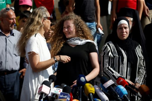 Palestinian activist and campaigner Ahed Tamimi (C) in the West Bank village of Nabi Saleh on July 29, 2018, after her release from prison