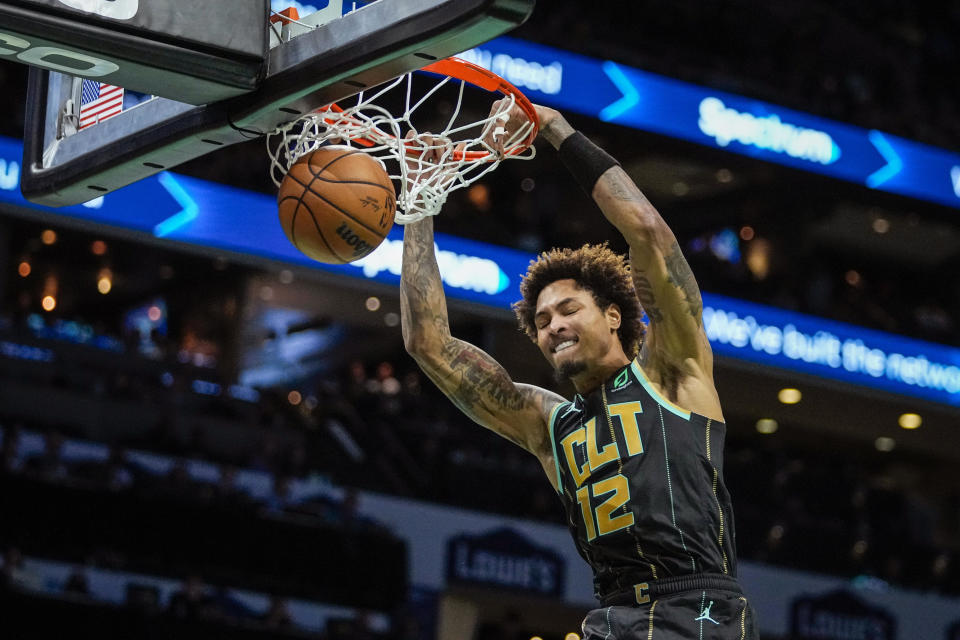 Charlotte Hornets guard Kelly Oubre Jr. dunks during the first half of an NBA basketball game against the Minnesota Timberwolves, Friday, Nov. 25, 2022, in Charlotte, N.C. (AP Photo/Rusty Jones)