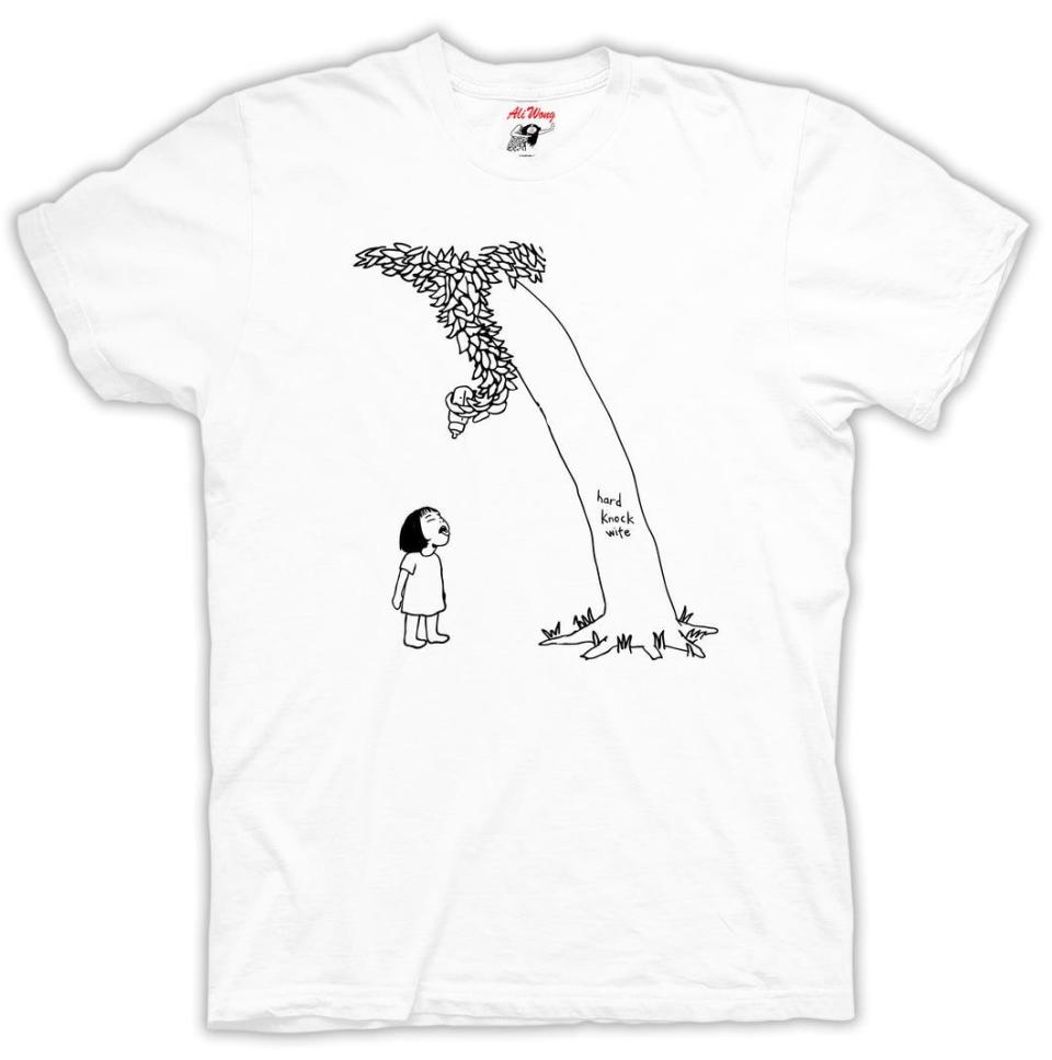 <p><a href="https://merchmethod.com/collections/ali-wong/products/giving-tree-white-tee" rel="nofollow noopener" target="_blank" data-ylk="slk:Shop Now;elm:context_link;itc:0;sec:content-canvas" class="link ">Shop Now</a></p><p>Giving Tree White Tee</p><p>$26.00</p><p>merchmethod.com</p>