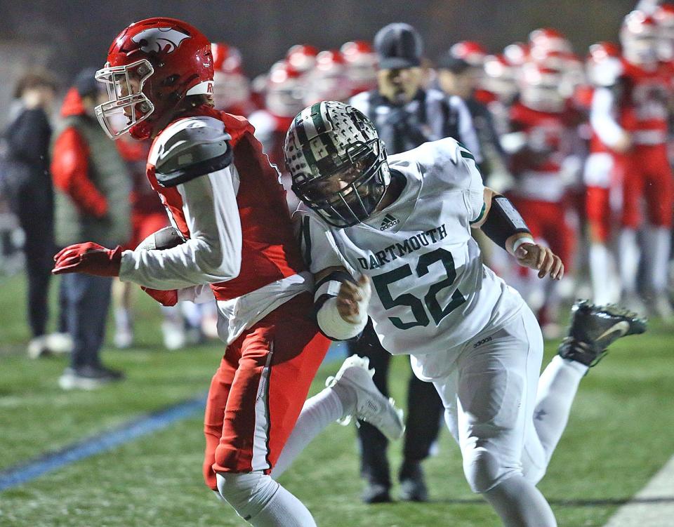 Milton's receiver Ronan Sammon gets pushed out of bounds short of the goal line by Dartmouth's Jason Martin.

Milton High hosted Dartmouth in MIAA playoff football action on Thursday, Nov. 9, 2023
