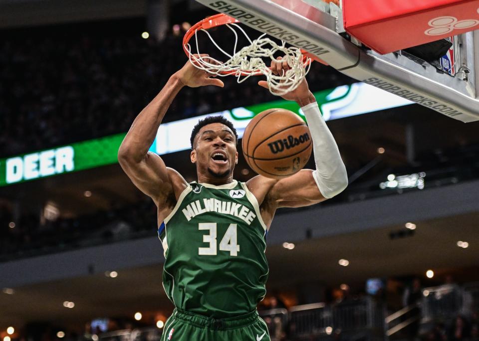 Giannis Antetokounmpo dunks against the Washington Wizards at Fiserv Forum.