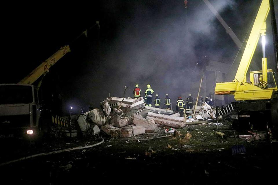 Rescuers working on the rubble of a residential building damaged by a missile strike on the outskirts of Dnipro (State Emergency Service of Ukrai)