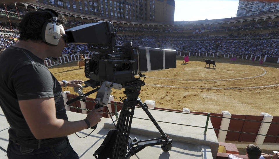 A TV camera films during a bullfight in Valladolid, Spain Wednesday Sept. 5, 2012. Bullfights returned live to Spanish state TV Wednesday evening, six years after the fights were banned from the widely watched public channel with the broadcast featuring one of Spain’s most storied bullfighters and giving a boost to a tradition hit hard by declining popularity and a dire economic crisis. The RTVE broadcast from the northern city of Valladolid is a big victory for pro-bullfighting forces that saw bullfighting banned altogether this year in the northeastern region of Catalonia; it’s a defeat for animal rights activists who denounce bullfighting as barbaric. The transmissions were halted in 2006 by Spain’s previous Socialist administration, which said they were costly and coincided with key TV viewing hours for young children. (AP Photo/Israel L. Murillo)