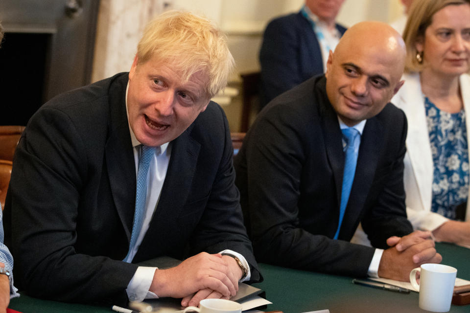 Britain's Chancellor of the Exchequer Sajid Javid (centre) and Secretary of State for Work and Pensions Amber Rudd with Prime Minister Boris Johnson (left) as he holds his first Cabinet meeting at Downing Street in London, Britain July 25, 2019. Aaron Chown/Pool via REUTERS
