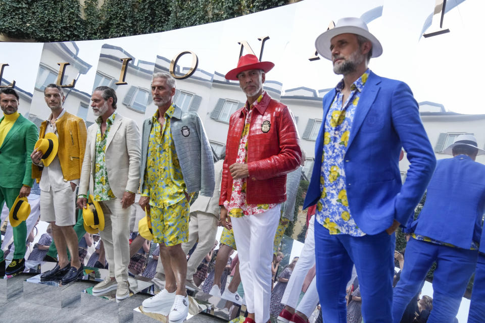 Model wear creations as part of the Billionaire men's Spring Summer 2023 collection presented in Milan, Italy, Friday, June 17, 2022. (AP Photo/Luca Bruno)