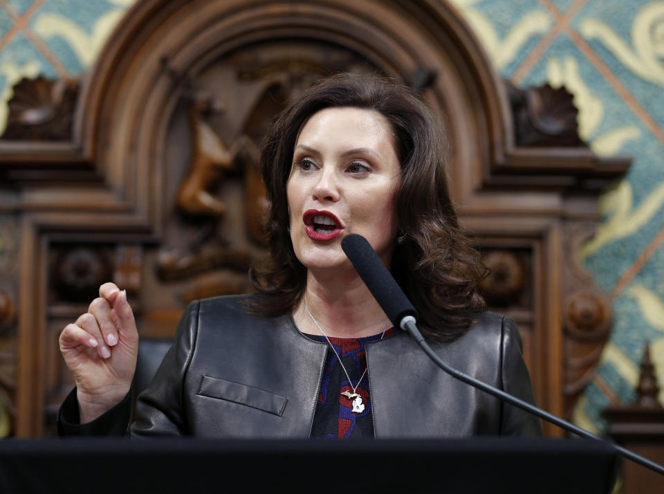 FILE - In this Jan. 29, 2020, file photo Michigan Gov. Gretchen Whitmer delivers her State of the State address to a joint session of the House and Senate at the state Capitol in Lansing, Mich. Across an arc of vital swing states, the coronavirus has put politics on an uneasy pause. The tension is most pronounced in Michigan, where the outbreak is far worse than in any of the other northern political battlegrounds. (AP Photo/Al Goldis, File)