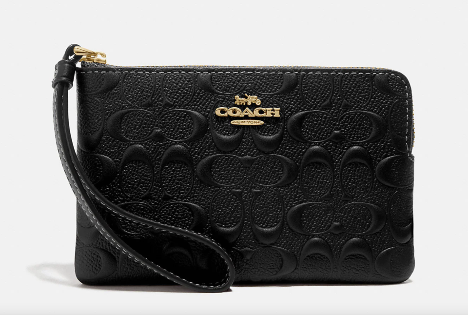 Corner Zip Wristlet in Signature Leather in black leather (Photo via Coach Outlet)